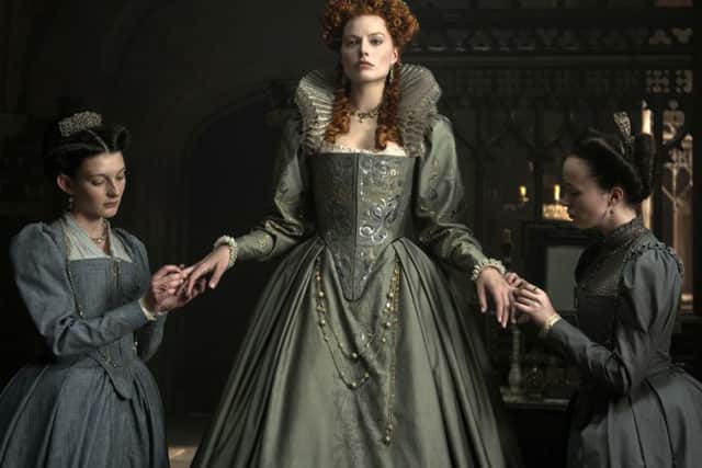 Grace Molony as Dorothy Stafford, Margot Robbie as Queen Elizabeth I and Georgia Burnell as Kate Carey in a scene from "Mary Queen of Scots." (Parisa Tag/Focus Features via AP)