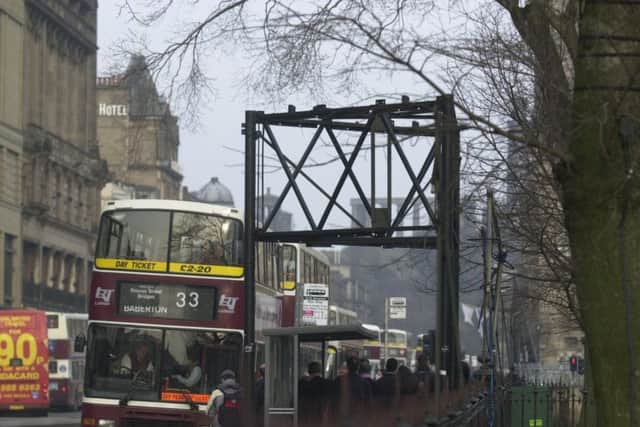 Removed in the early 2000s, we don't really miss the Princes Street tripods that much, but they were decorated with cool lights at Christmas.