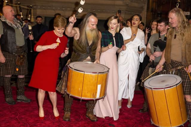 First Minister Nicola Sturgeon and Saoirse Ronan dance with the band as they attend the Scotland premiere of Mary Queen of Scots. Picture: Getty Images