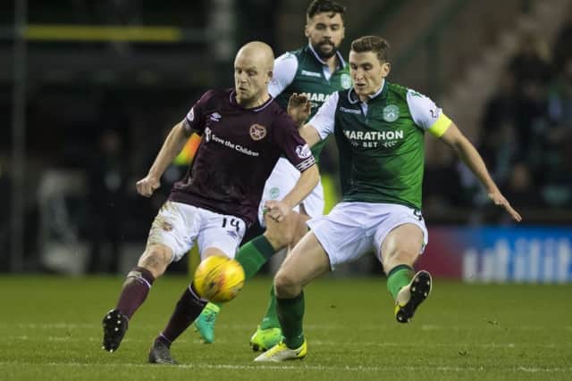 Hearts' Steven Naismith (L) in action with Paul Hanlon of Hibs during the last Edinburgh derby. Picture: SNS Group