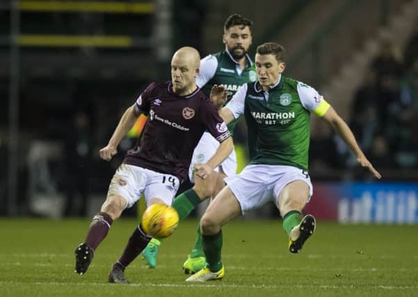Hearts' Steven Naismith (L) in action with Paul Hanlon of Hibs during the last Edinburgh derby. Picture: SNS Group