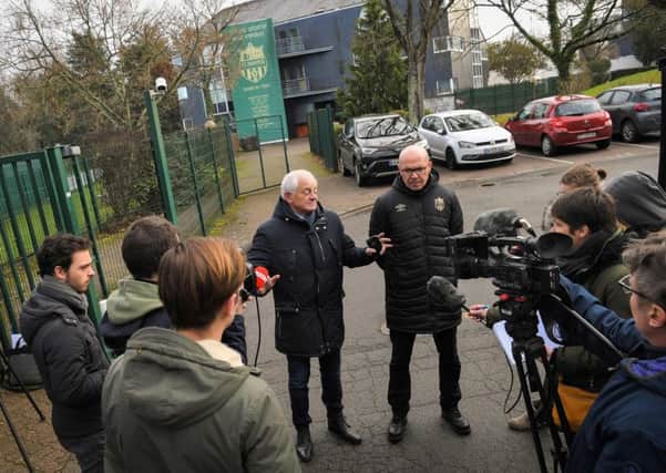 Staff members talk to journalists at the entrance of the FC Nantes training centre Pic: VENANCE/AFP/Getty Images