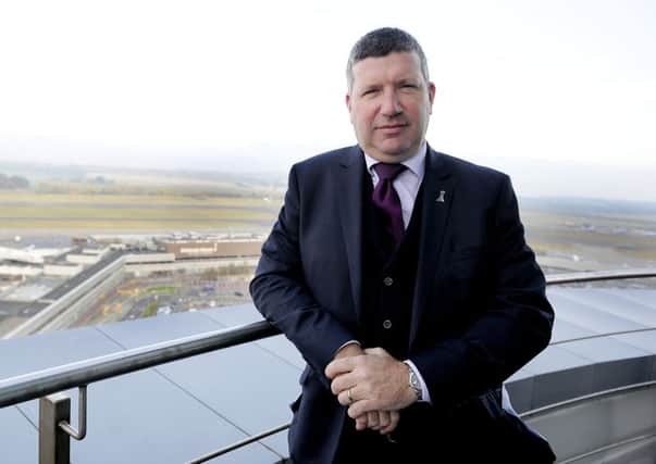 Edinburgh Airport boss Gordon Dewar says the SNP's passenger duty plan should be debated at Holyrood. Photograph: Michael Gillen