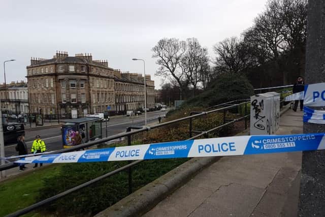 A police cordon is in place and two officers are standing guard. Picture: Contributed