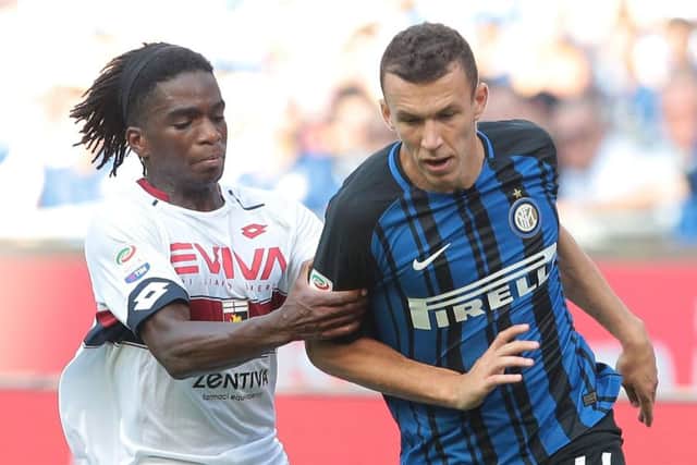 Stephane Omeonga (right) gets to grips with Internazionale's Croatian international Ivan Perisic. Picture: Getty Images