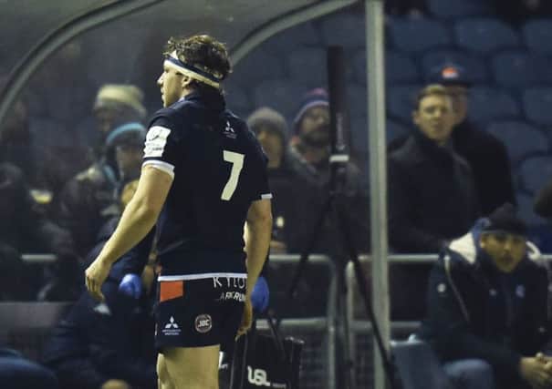 Edinburgh's Hamish Watson goes off with a hand injury suffered playing against Montpellier