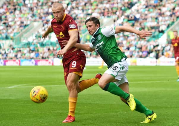Hibs' Lewis Stevenson and Motherwell's Curtis Main clash back in August. Pic: SNS