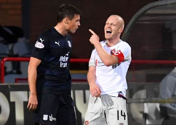 Hearts' Steven Naismith has a laugh at Dundee's Darren O'Dea during the meeting between the two teams back in October. Pic: SNS