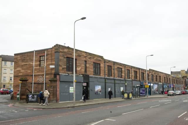 The empty retail units on Leith Walk are boarded up in preparation for redevelopment. Picture: JP