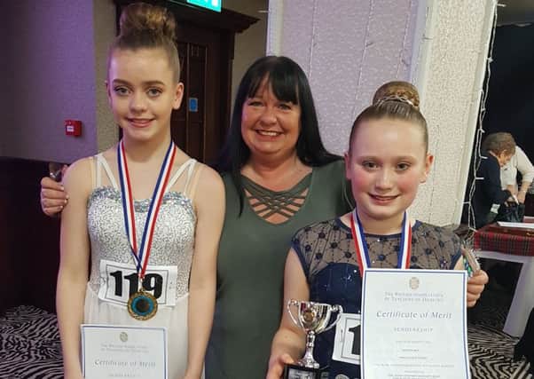 Wren Dance Studio Dalkeith highland dancers Callie Wilson (14) a pupil at St David's High School, and Bethan May (10)  a pupil at Tynewater Primary School. pictured with teacher Betty Wren.