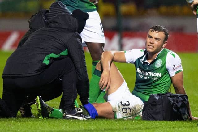 Ryan Porteous receives treatment before being substituted at Fir Park