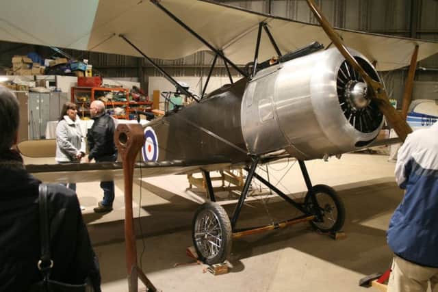 Members of the Aviation Preservation Society of Scortland work on the Sopwith biplane