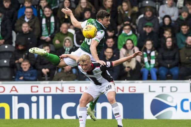 Lewis Stevenson flies over the top of Cammy Macpherson as Hibs defeated St Mirren earlier in the campaign. Picture: SNS
