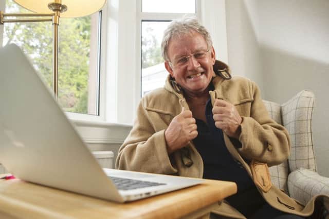 Terry Christie with his famous duffle coat at home in Duddingston. Picture: Toby Williams