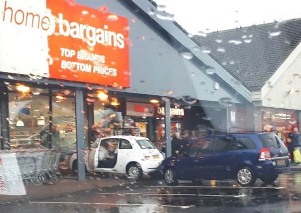 A car crashed into the front of the Home Bargains store in Bathgate. Picture: Kirsty Cochrane