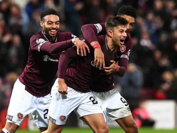 Marcus Godinho sets off to celebrate after giving Hearts the lead against St Johnstone
