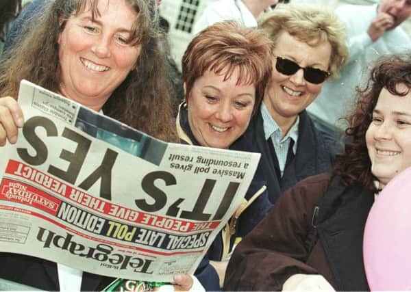 People celebrate the 71 per cent vote in favour of the Good Friday agreement in a referendum held in Northern Ireland on May 22, 1998. Picture: PA