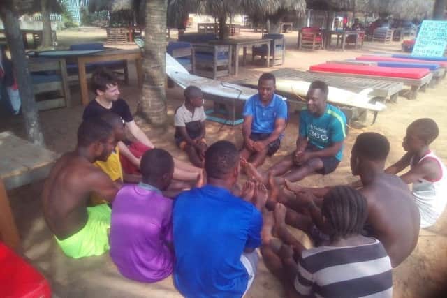 Jamie gets involved with some of the surf therapy sessions with young people in Liberia.