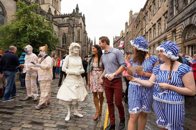 A scene from the filming of the VisitScotland 'Homecoming 2014' advert. Edinburgh Festival Fringe - High Street, Royal Mile, Edinburgh. Pic: Paul Tomkins / VisitScotland
