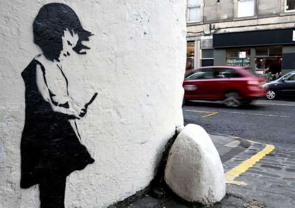A Banksy-style image has appeared on a wall on Grindlay Court, Edinburgh. Pic Lisa Ferguson