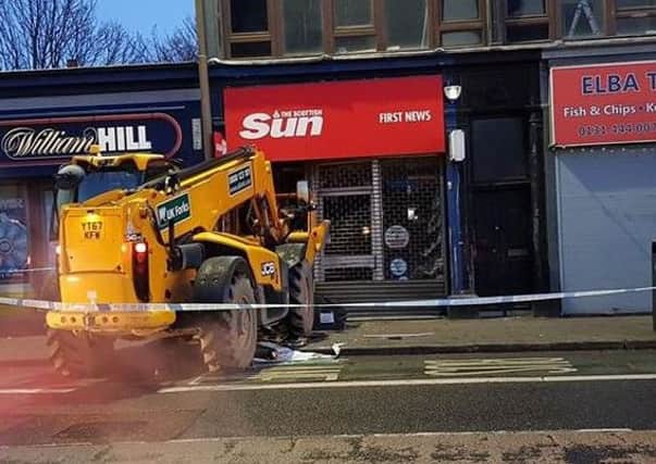 A digger has crashed into a newsagents on Gorgie Road. Picture: Contributed