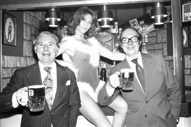 Eric Morecambe and (left) Ernie Wise enjoy a pint of Tennent's lager with Erica, one of the 'can models' when they visited the Heriot brewery at Roseburn, Edinburgh, in 1978.