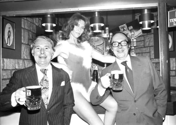 Eric Morecambe and (left) Ernie Wise enjoy a pint of Tennent's lager with Erica, one of the 'can models' when they visited the Heriot brewery at Roseburn, Edinburgh, in 1978.