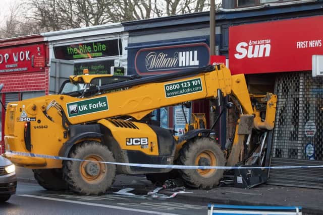 A digger which smashed into shops on Gorgie Road was stolen from a nearby building site. Picture: SWNS