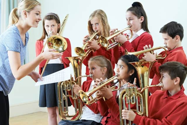 Group of students playing in a school orchestra together