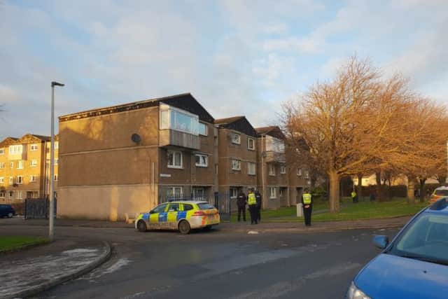 Officers at the scene in Saughton. Pic: Ian Georgeson