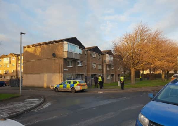 Officers at the scene in Saughton. Pic: Ian Georgeson