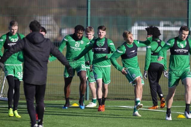 The Hibs squad, including new additions Darnell Johnson, Gael Bigirimana and Marc McNulty, are put through their paces at East Mains. Picture: SNS Group