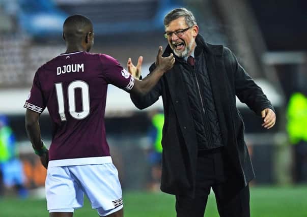 Hearts manager Craig Levein celebrates with Arnaud Djoum after the 2-1 win over Kilmarnock. Pic: SNS
