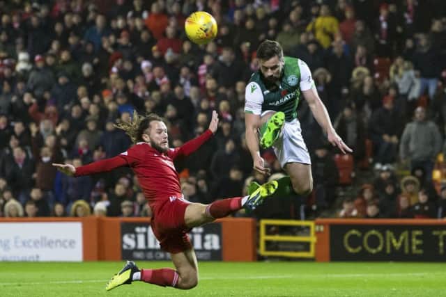 Stevie May and Darren McGregor battle for the ball in the last clash between the two sides. Picture: SNS Group