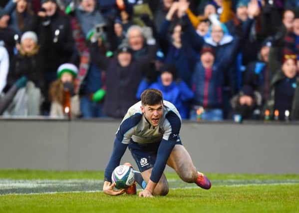 Scotland's Blair Kinghorn scores his third try in the 33-20 win over Italy. Pic: SNS