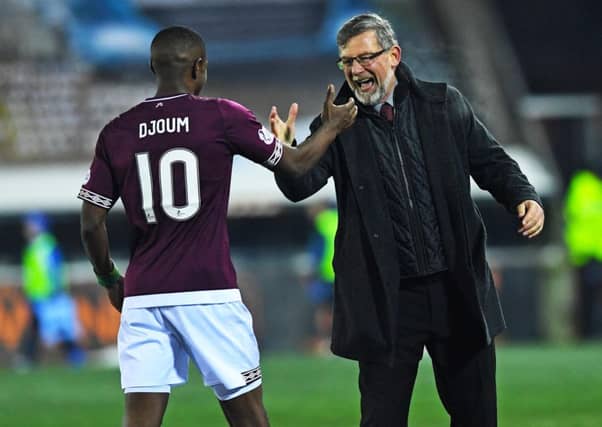 Hearts Manager Craig Levein (left) with Arnaud Djoum. Picture: SNS/Craig Williamson