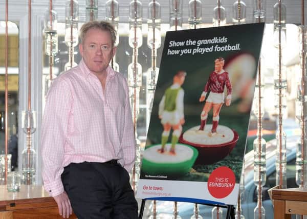 John Donnelly unveils artwork for a Marketing Edinburgh promotional campaign. Picture: Neil Hanna
