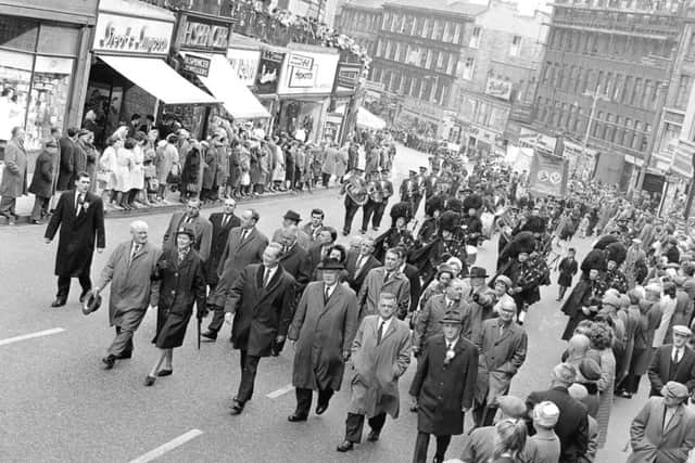 Leith Street was on the route for the annual Miners Gala Day march. We can see crowds of people watching on either side, including up on Leith Street Terrace.