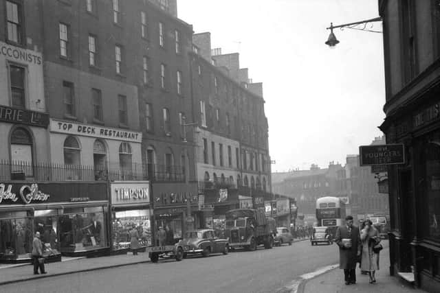 Picture shows (left hand side) the Top Deck restaurant, John Collier menswear and Timpson's shoe shop. Local couple Alexander and Margaret Waugh recognised themselves to the right of the picture when it was published as part of the Living Memories series in the Evening News.
