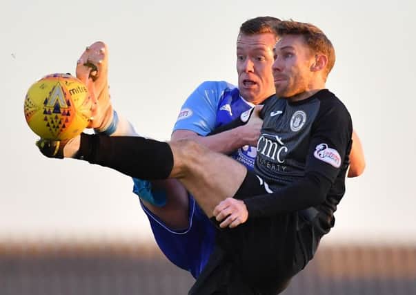 City's Danny Galbraith battles with Peterhead's Scott Brown. Pic: Duncan Brown