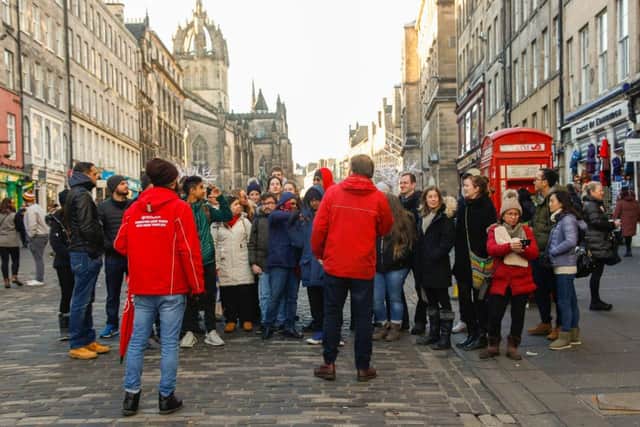 New Year 2019 - New Year's Day tourists on The High St on a guided tour