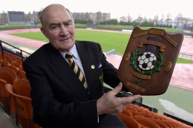 John Bain, ex manager of then Meadowbank Thistle now Livingston FC pictured at Meadowbank,with a trophy from when Meadowbank Thistle won the old 2nd division title.