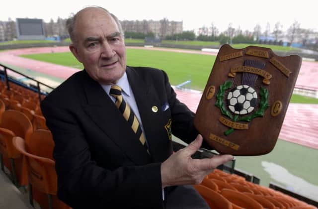John Bain, ex manager of then Meadowbank Thistle now Livingston FC pictured at Meadowbank,with a trophy from when Meadowbank Thistle won the old 2nd division title.