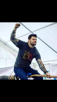 Stanislav Ianevski, who plays Viktor Krum in the Harry Potter films, entertains crowds on the bucking bronco style 'broomstick challenge'