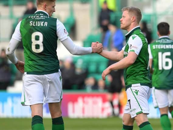 Vykintas Slivka,  scorer of Hibs second goal against Raith Rovers,  congratulates Daryl Horgan on opening the scoring for the Easter Road side