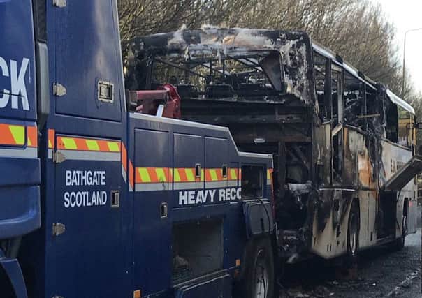 The fire-damaged bus.