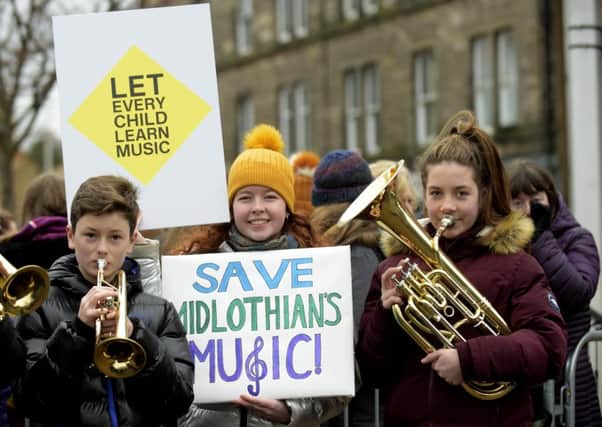A musical flash mob gathered on Tuesday outside the council chambers in Dalkeith. Pic: Lisa Ferguson