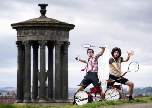 L-R: French drumming duo Sébastien Rambaud and Yann Coste get some practice in, on Edinburgh's Calton Hill, ahead of their hotly anticipated Edinburgh Festival show. Pic: Jane Barlow