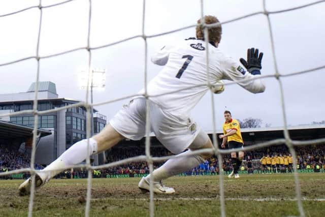 Partick's Conrad Balatoni sees his penalty saved by Queen of the South goalkeeper Lee Robinson in the penalty shootout in the Final at Almondvale