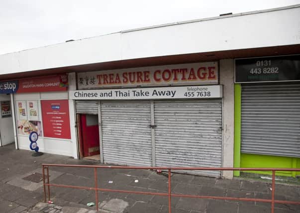 Saughton Mains Gardens shops where a chinese takeaway was raided last night. Picture: TSPL